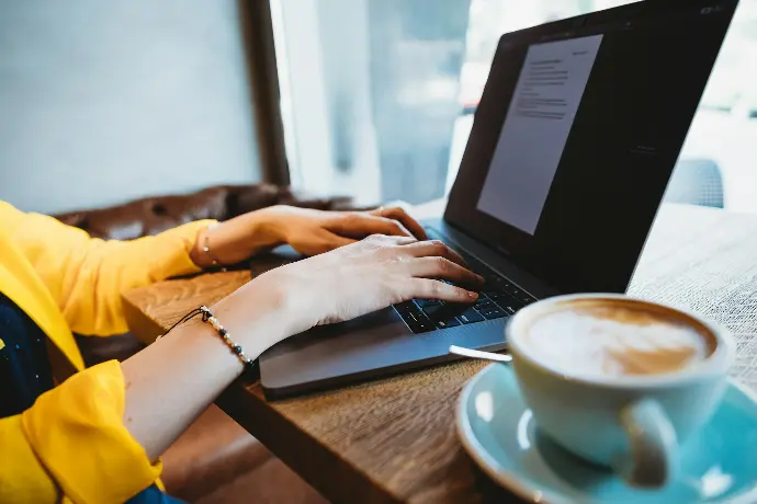 person using black laptop computer